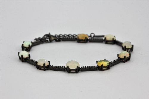 A 925 silver bracelet set with cabochon cut opals and white stones, L. 17cm. - Image 2 of 2