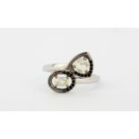A 925 silver crossover ring set with opals and black spinels, (R).