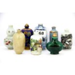 A group of eight porcelain Chinese snuff bottles.