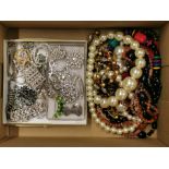 A box of mixed costume jewellery.