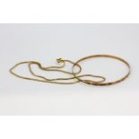 A 9ct yellow gold chain necklace and 9ct gold bangle, approx. 7.3gr.