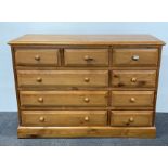 A heavy quality pine nine drawer chest, W. 136cm. H. 96cm.