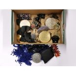 A box of vintage compacts and other items.