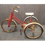 A vintage child's tricycle, H. 73cm. L. 103cm.