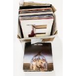 A large collection of records including Cat Stevens, Dire Straits, Elton John, Pat Benatar, Bryan