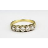 A yellow metal (tested 18ct gold) ring set with brilliant cut diamonds, approx. 0.80ct overall, (O.