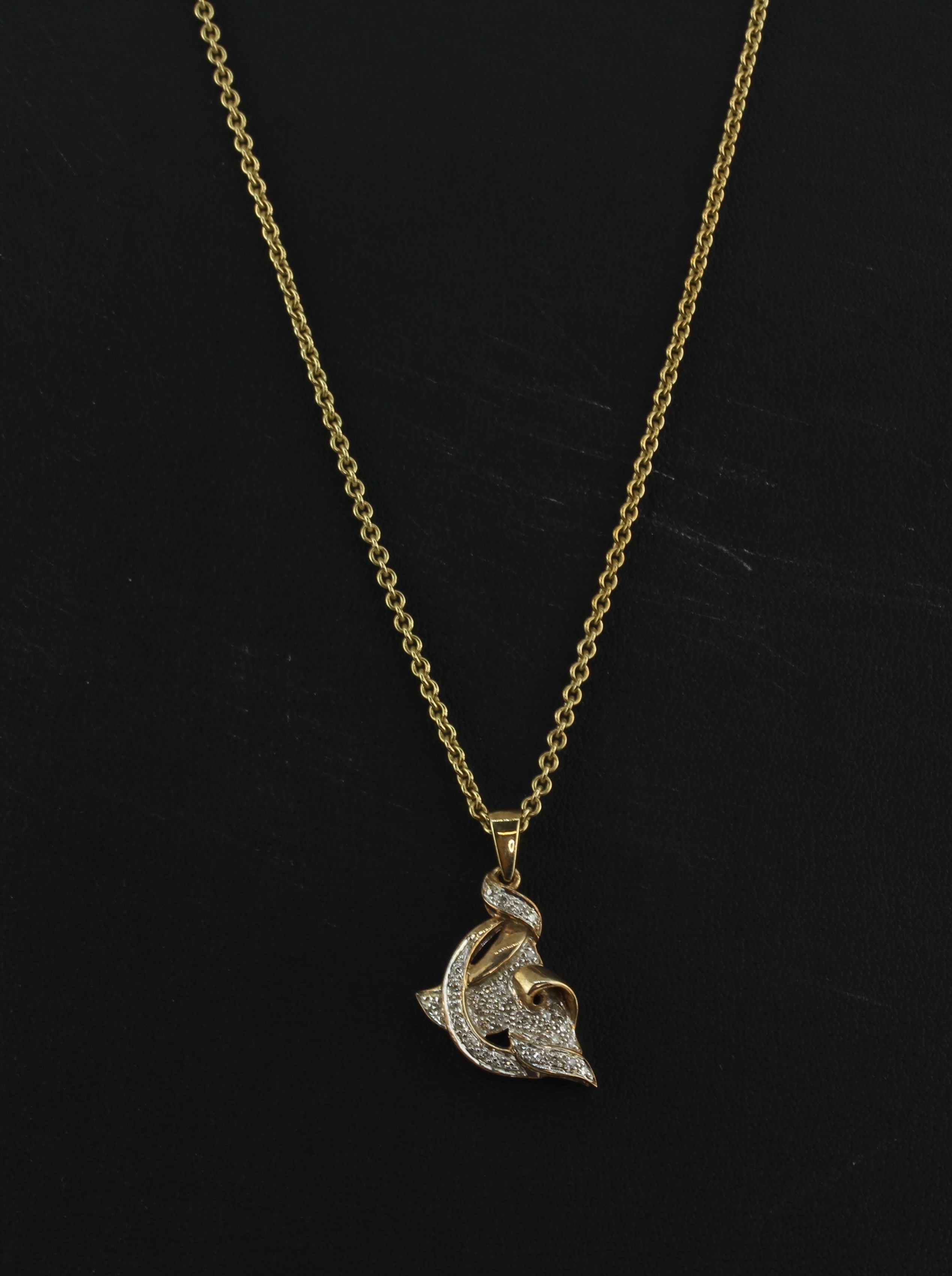 A 9ct yellow gold diamond set pendant and chain, approx. 8.8gr. - Image 2 of 2