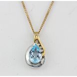 A 9ct yellow and white gold pendant set with a pear cut blue topaz and diamonds, on a 9ct gold