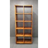 A contemporary sheesham wood display cabinet, 80 x 36 x 184cm.