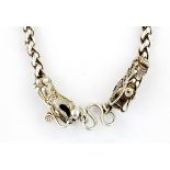 A heavy Chinese white metal dragon necklace.