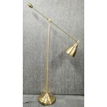 A gilt brass standard reading lamp.