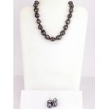 A superb lustrous brown / grey baroque pearl necklace and earrings, pearl size 20mm, necklace length