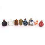 A group of eight Chinese porcelain, glass and other snuff bottles.