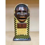 A vintage German tin money box with pop out tongue, H. 18cm. (Missing top)