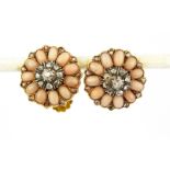A pair of antique yellow metal (tested gold) cluster screw back fitted earrings set with coral and