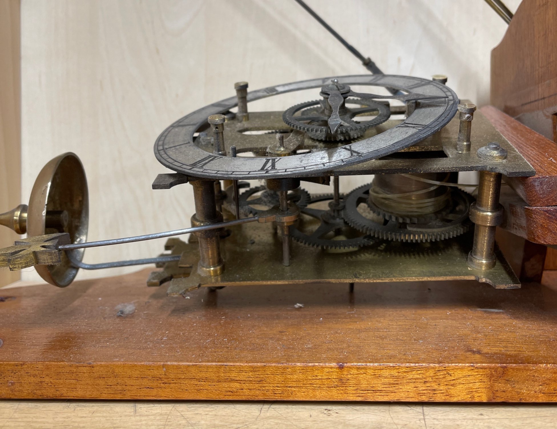 A wall mounted part skeleton wall clock. - Image 2 of 2