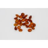 A quantity of unmounted orange citrines, approx. 53ct.