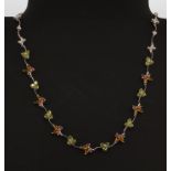 A Gemtique 18ct white gold butterfly necklace set with peridots, citrines and pink tourmalines, L.