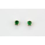 A pair of 14ct yellow gold emerald set stud earrings, Dia. 0.4cm.