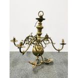 A large brass six branch chandelier light fighting, 68cm x 65cm.