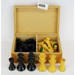 A weighted turned wooden chess set, king H. 7.5cm.