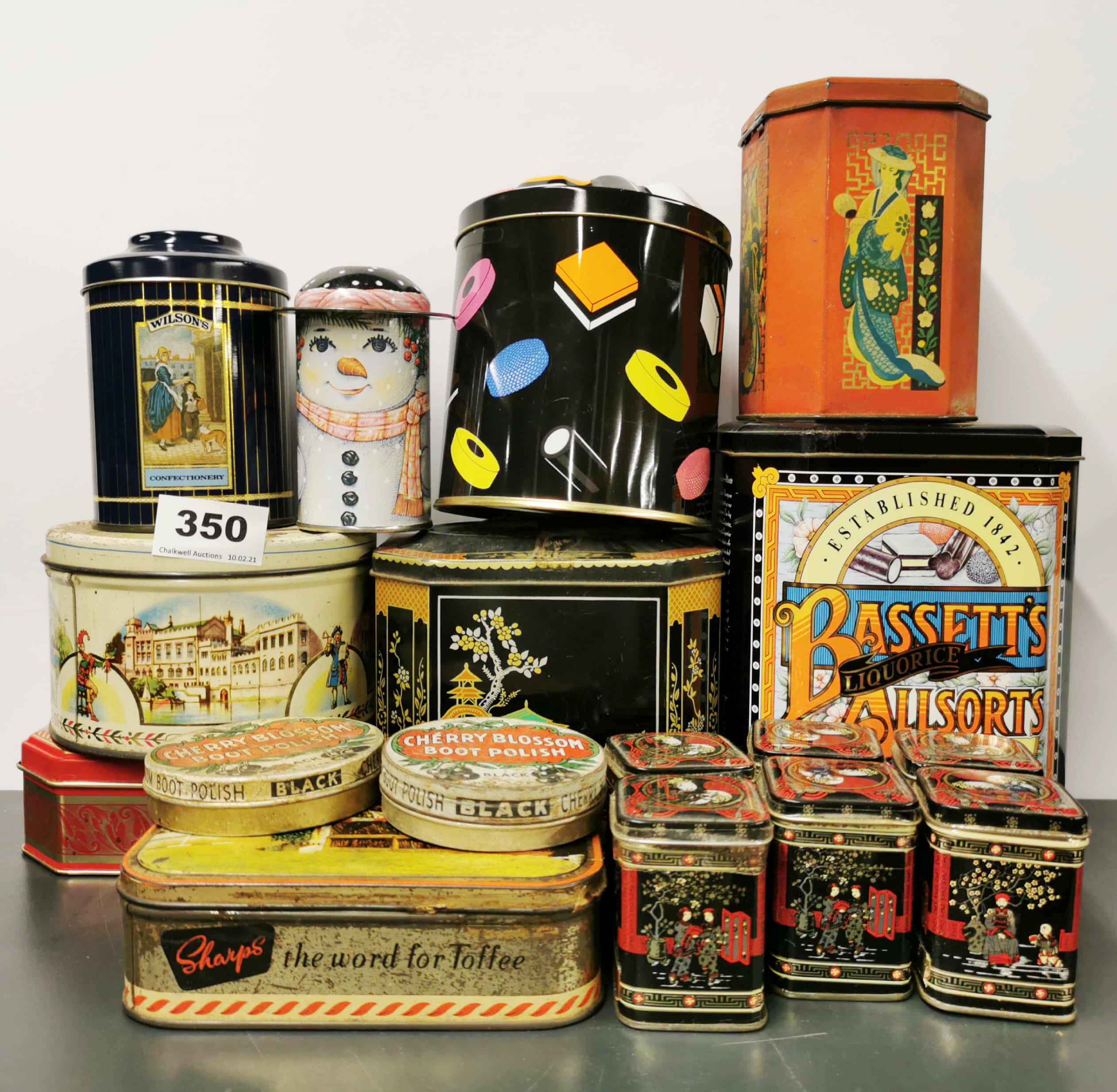 A quantity of vintage advertising tins.