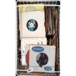 A collection of mixed 45 RPM records.