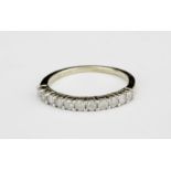 An 9ct yellow gold diamond set half eternity ring, approx. 0.50ct, (N.5).