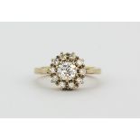 A 9ct yellow gold diamond set cluster ring, approx. 1ct overall, (L).
