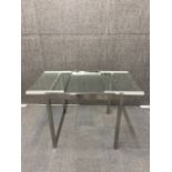 A 70's/80's stainless steel and glass extending table, 70 x 74cm. extending to 115 cm.