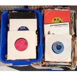 A collection of mixed 45 RPM records.