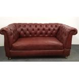A 1920's upholstered button back drop end two seater settee, W. 158cm.