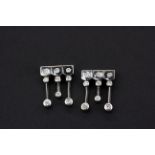 A pair of 18ct white gold diamond set earrings, L. 1.7cm.