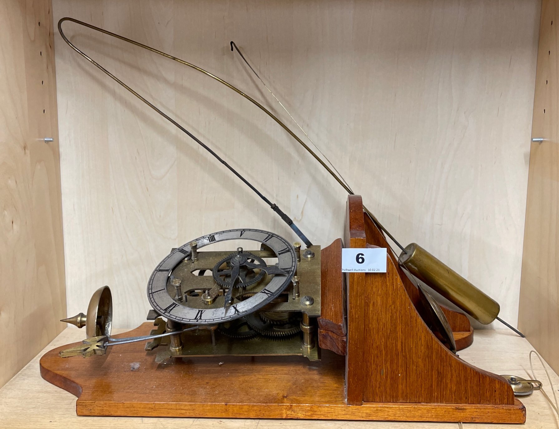 A wall mounted part skeleton wall clock.