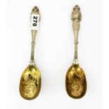 A large pair of early Victorian hallmarked silver embossed spoons, L. 22 cm.