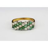 A 9ct yellow gold emerald and white stone set ring, (Q).