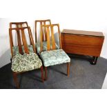 A 1970's heavy quality teak drop leaf dining table with four teak chairs.