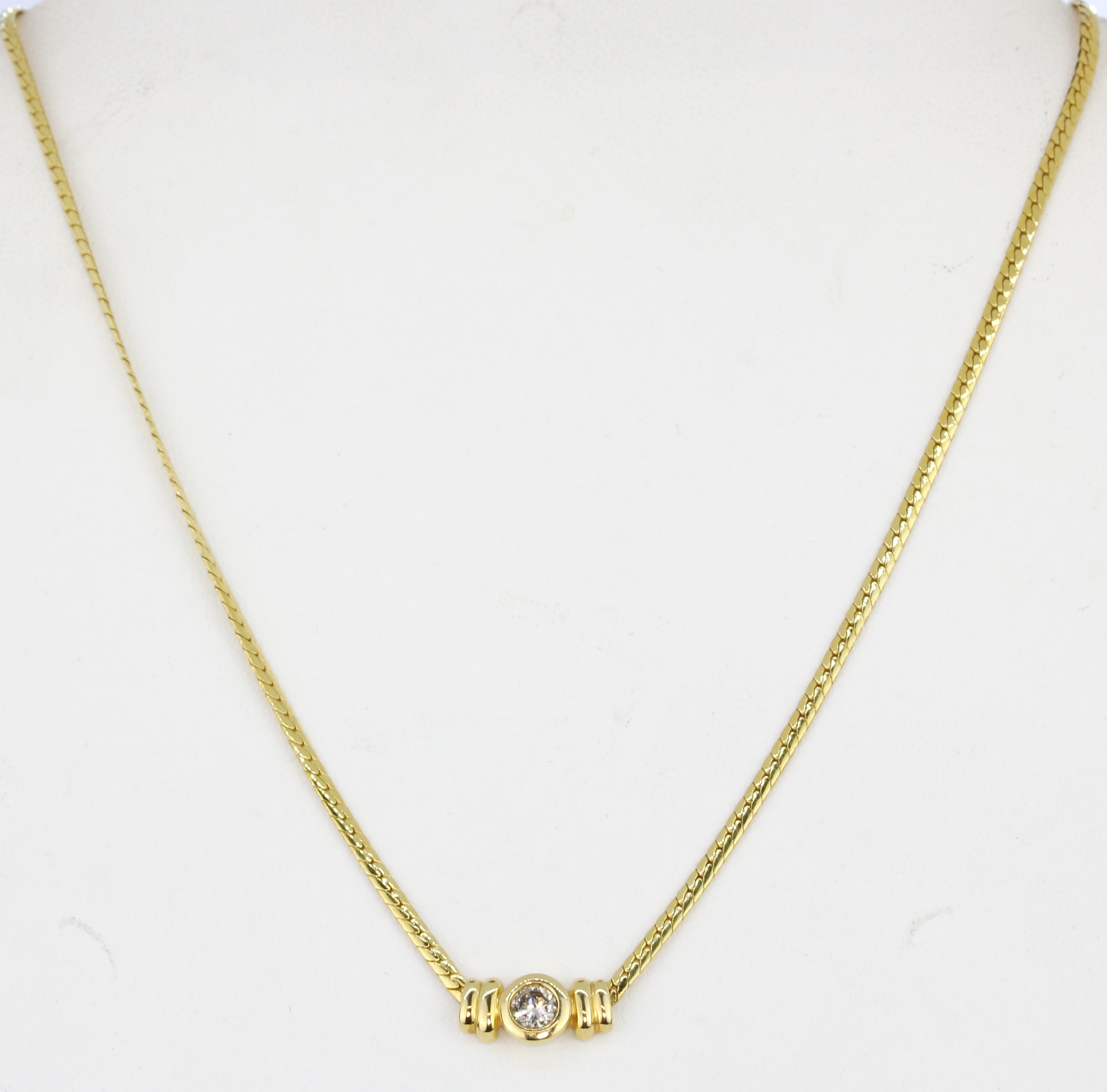 An 18ct yellow gold (stamped 750) necklace set with a brilliant cut diamond, L. 42cm. - Image 2 of 2