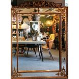 A large French antique style gilt framed mirror with bevelled glass panels, W. 136cm x H. 193cm.
