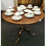 An 18th C. circular mahogany tilt-top table on turned pedestal tripod base, dia. 83cm, H. 71cm.