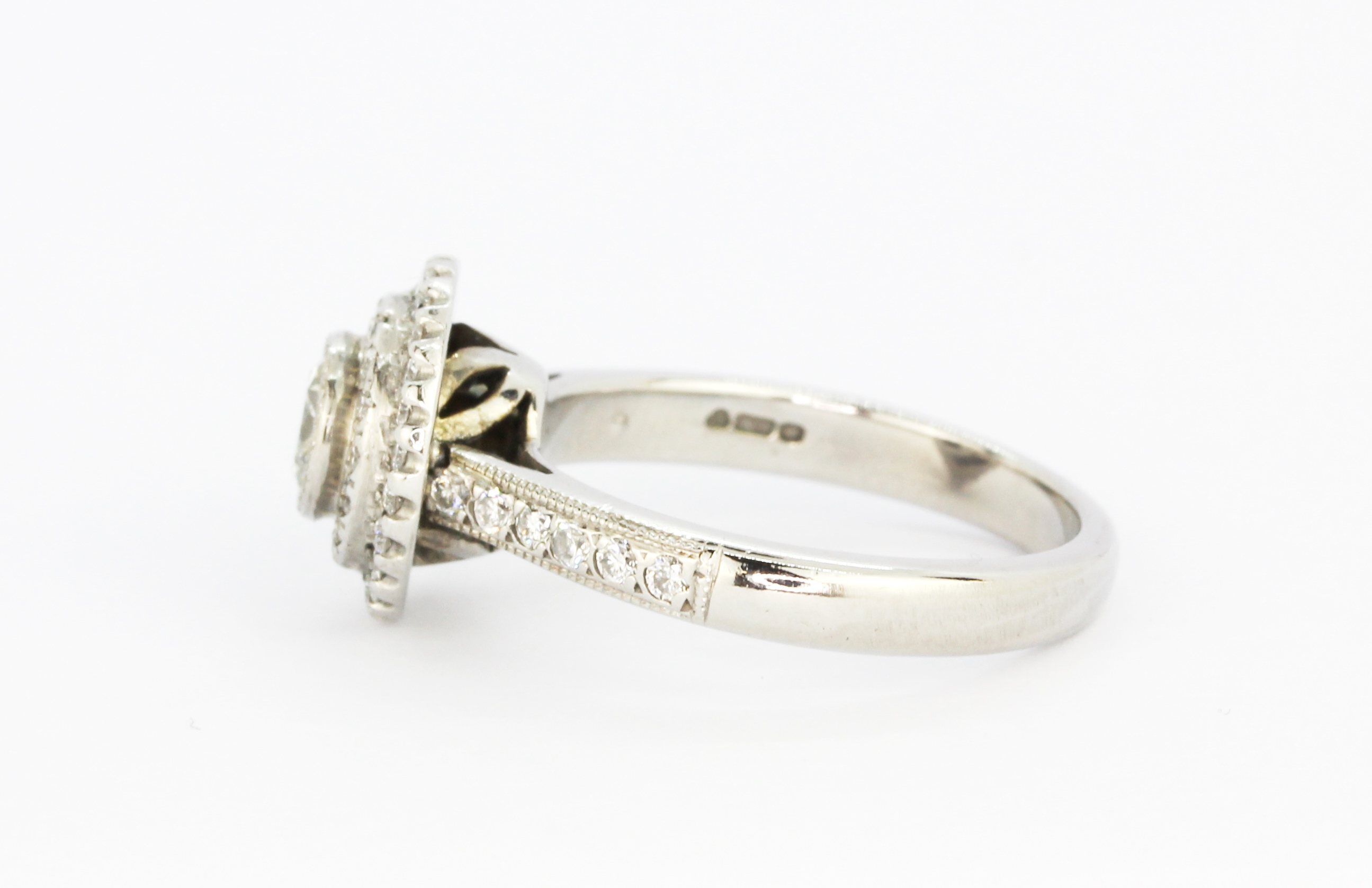 An 18ct white gold halo ring set with a brilliant cut centre diamond surrounded by brilliant cut - Image 3 of 3