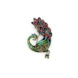 A 925 silver and marcasite enamelled peacock shaped brooch set with rubies, L. 6cm.