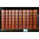 Ten red leather bound volumes of Scott's Novels published by McMillan and Co '1901' bound by Riviere