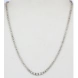 An 18ct white gold necklace set with brilliant cut diamonds, approx. 3ct overall, L. 42cm.