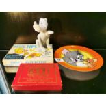 A Tom and Jerry limited edition plate, ceramic cartoon dog and two games.