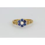 A 9ct yellow gold sapphire and daimond set cluster ring, (L).