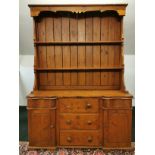 A Victorian pine Duchess dresser with later plate rack, W. 133cm x H. 173cm.