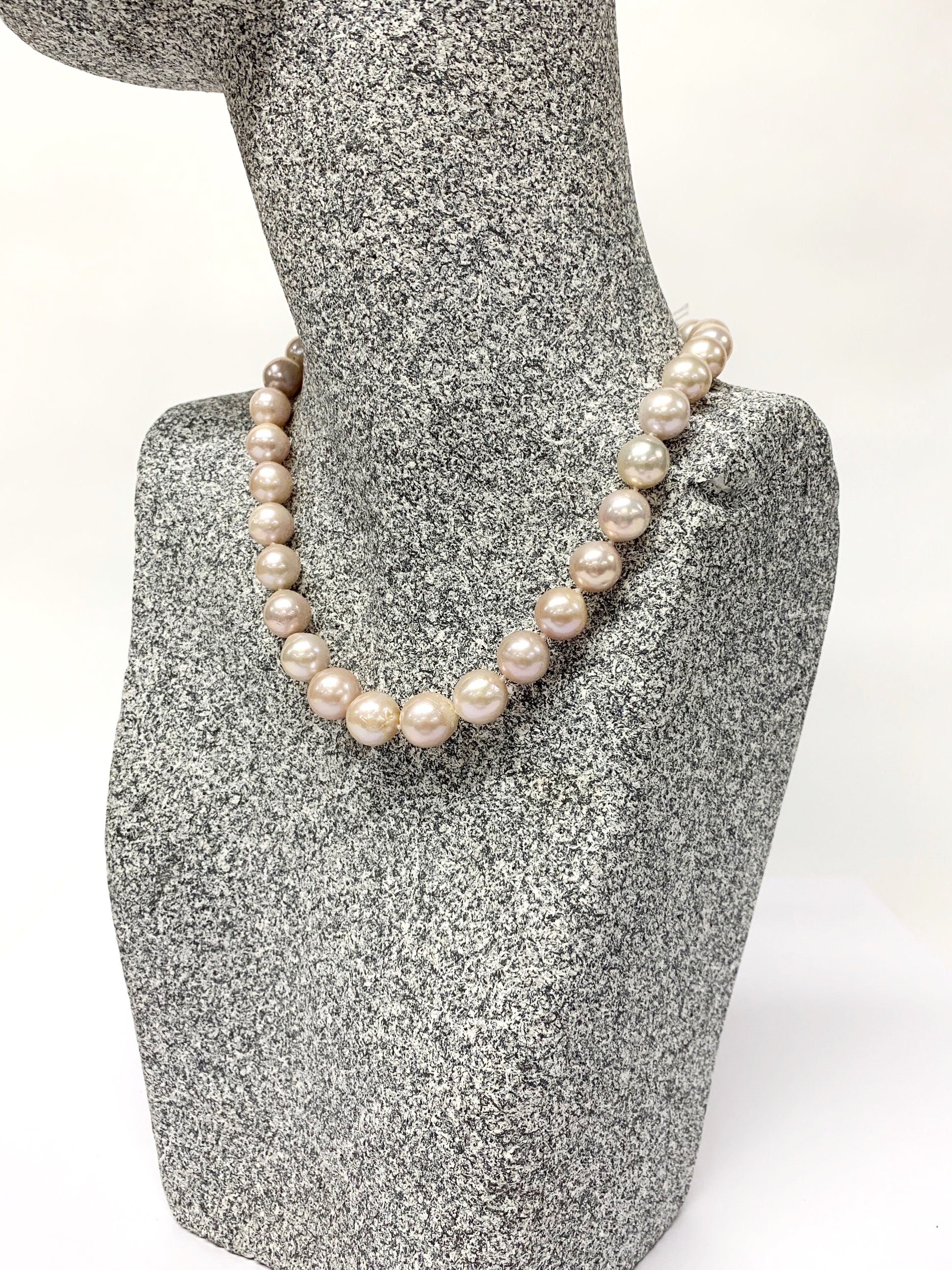 A lovely single strand necklace of lustrous large 12mm cultured pearls, necklace L. 40cm.