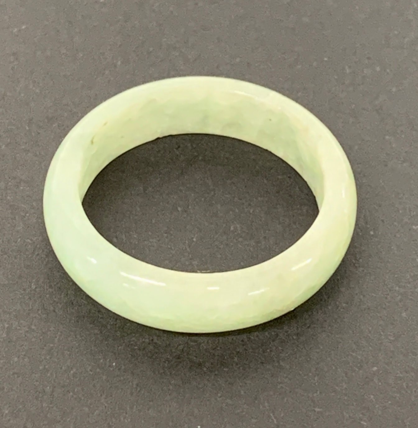 A fine Chinese pale green jade wedding ring, W. 5.5mm ring size - U.