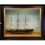 A very impressive cased oak framed model of the Cutty Sark, scratch built in wood, frame size